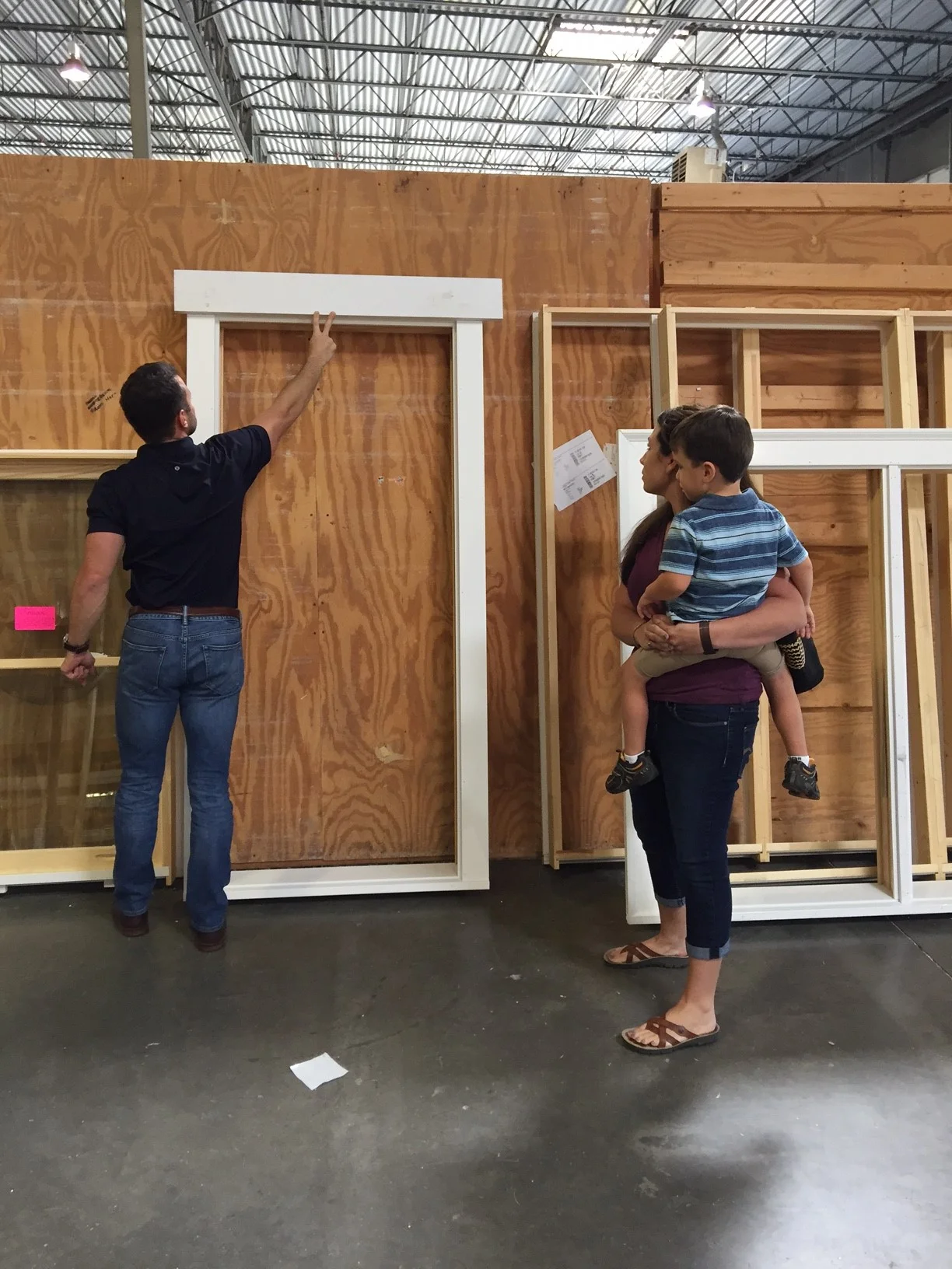Reid Lummus shows Steph the options for trim on the Enviroguard windows.
