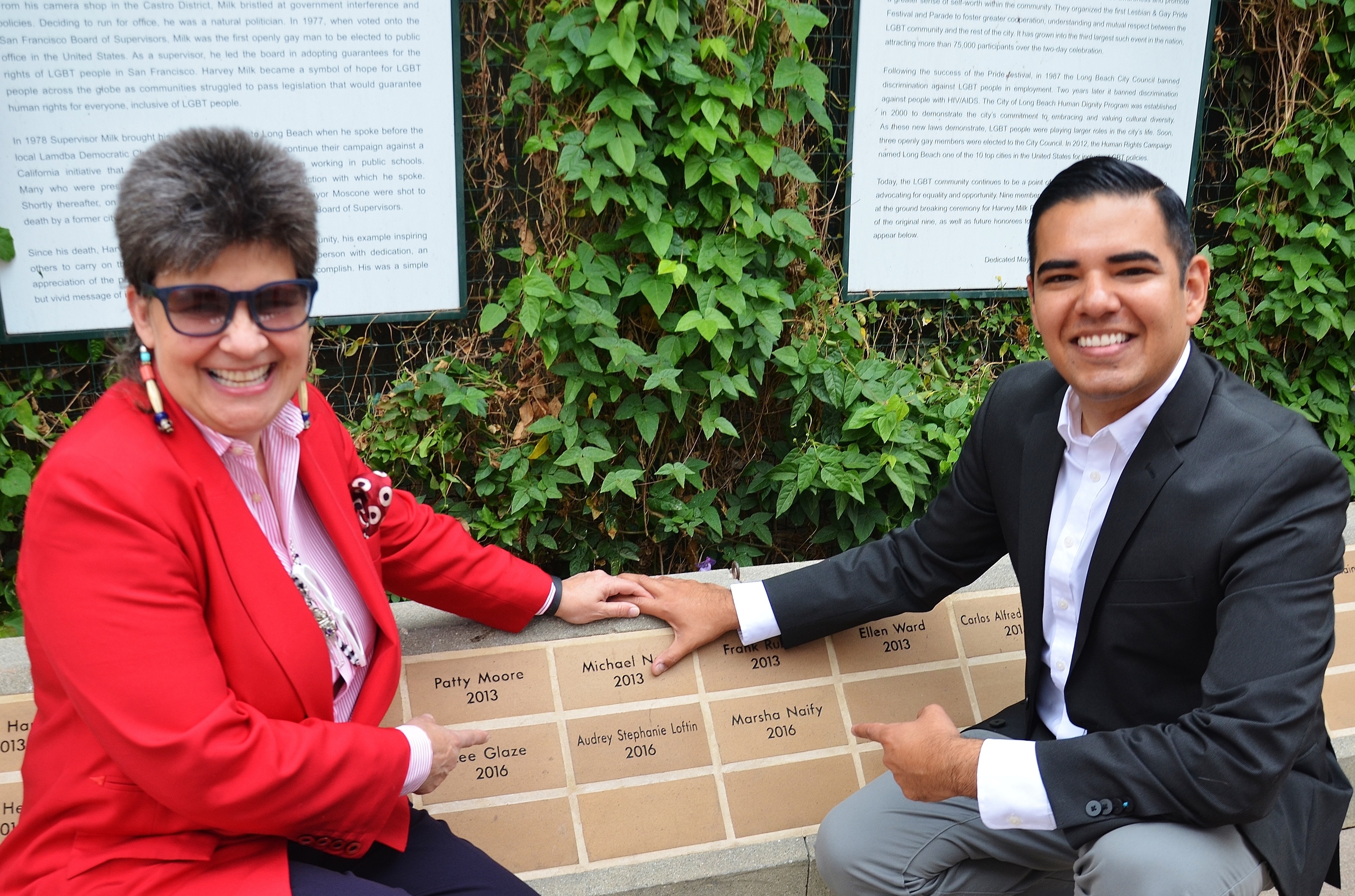 Attorney Stephanie Loftin and Mayor Robert Garcia at the Harvey Milk Promenade Park wall