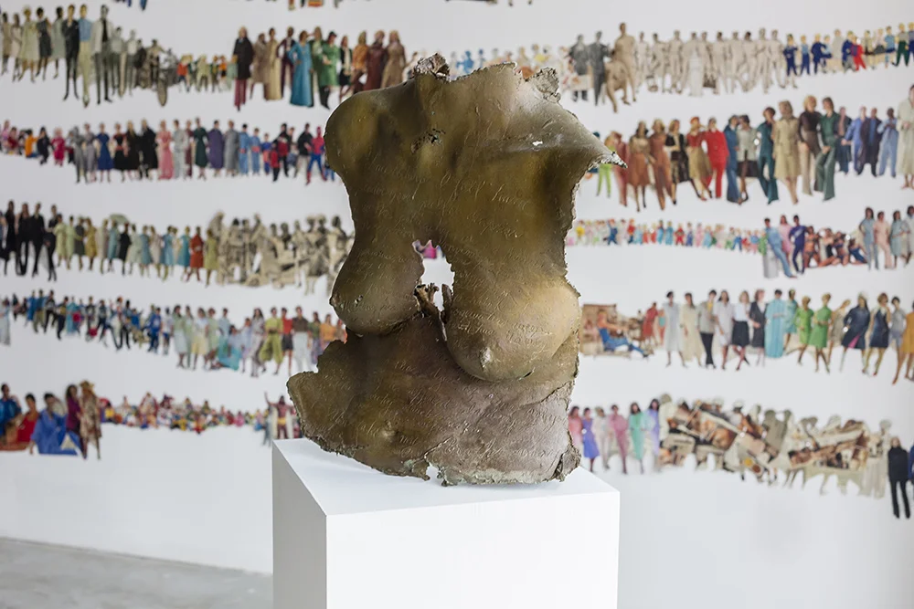 consume her demand , 2015. Bust by artist Mary Coss, paper dolls by Monique Motut-Firth
