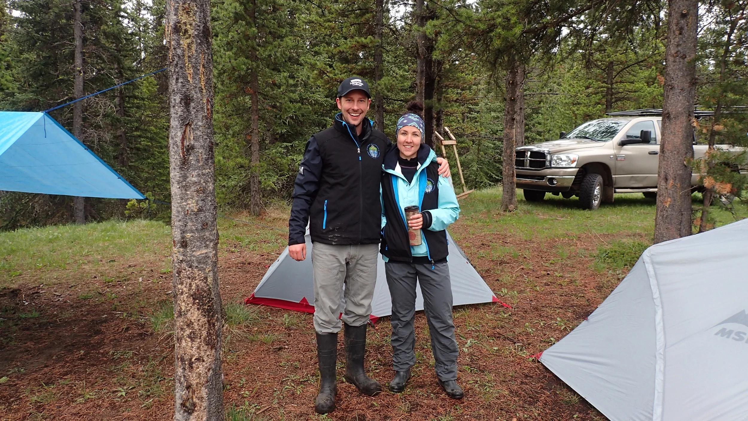 Ryan and Nicola setting up camp in the rain