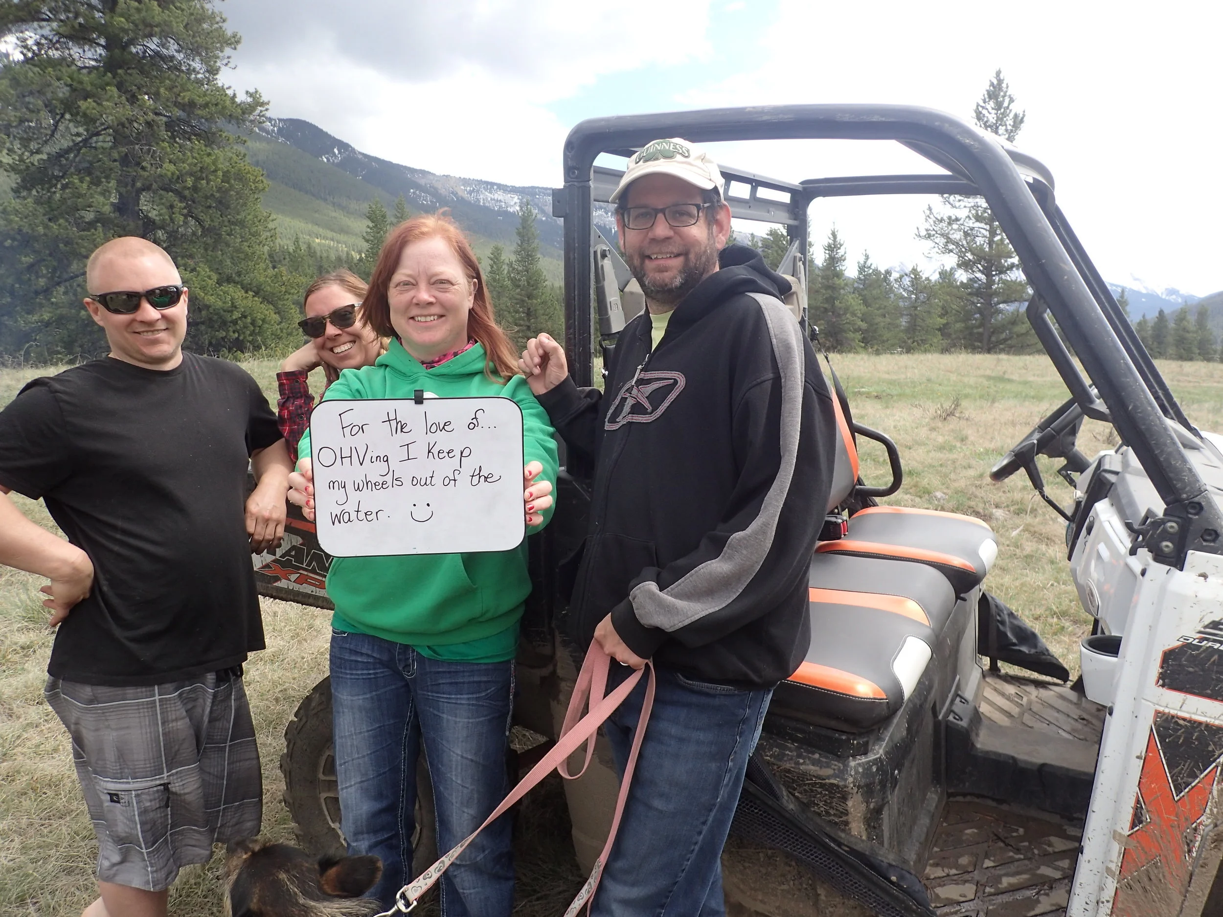 More random campers making "For the love of" pledges, this time along the Trunk Road. Text reads: "For the love of OHVing I keep my wheels out of the water."