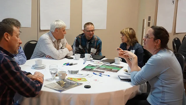 Participants discussing agricultural watershed stewardship at the Taber session.