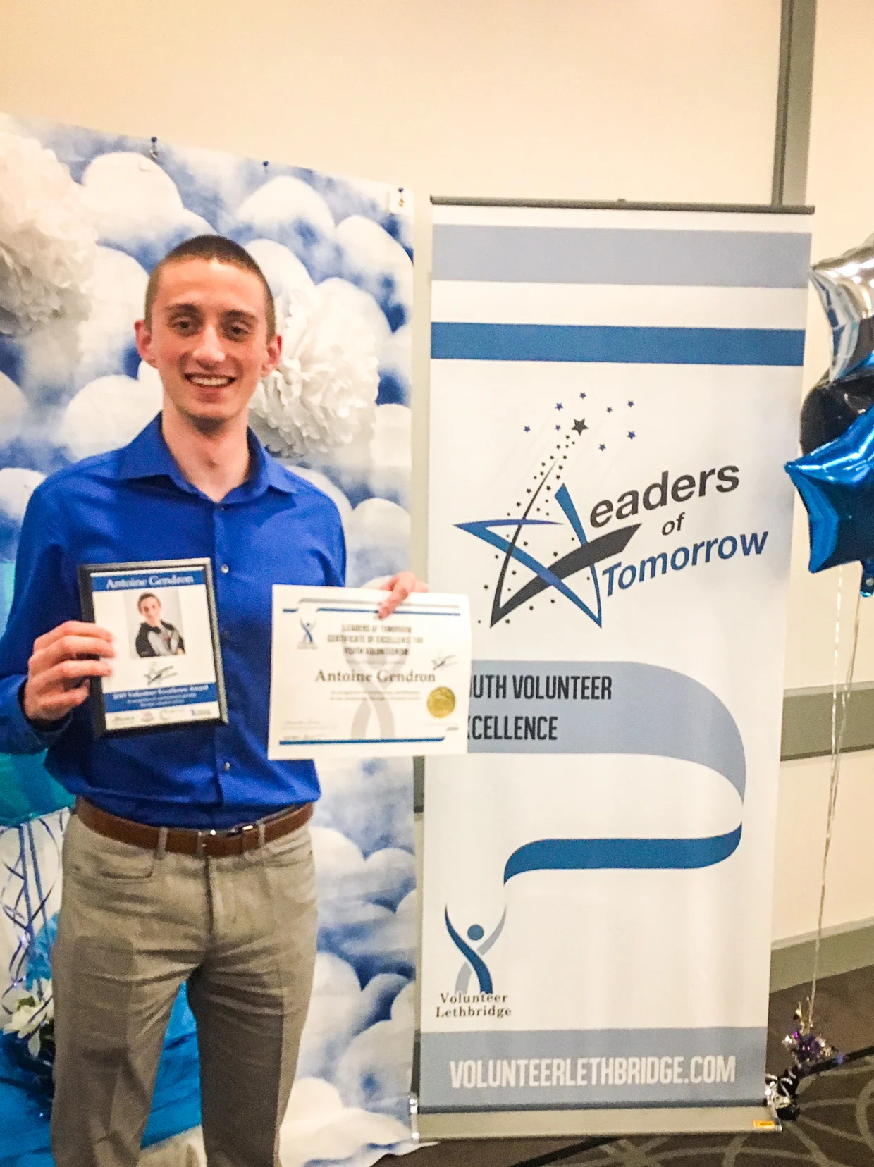 Antoine showing off his Excellence Award at the 22nd Annual Leaders of Tomorrow Gala in 2019.