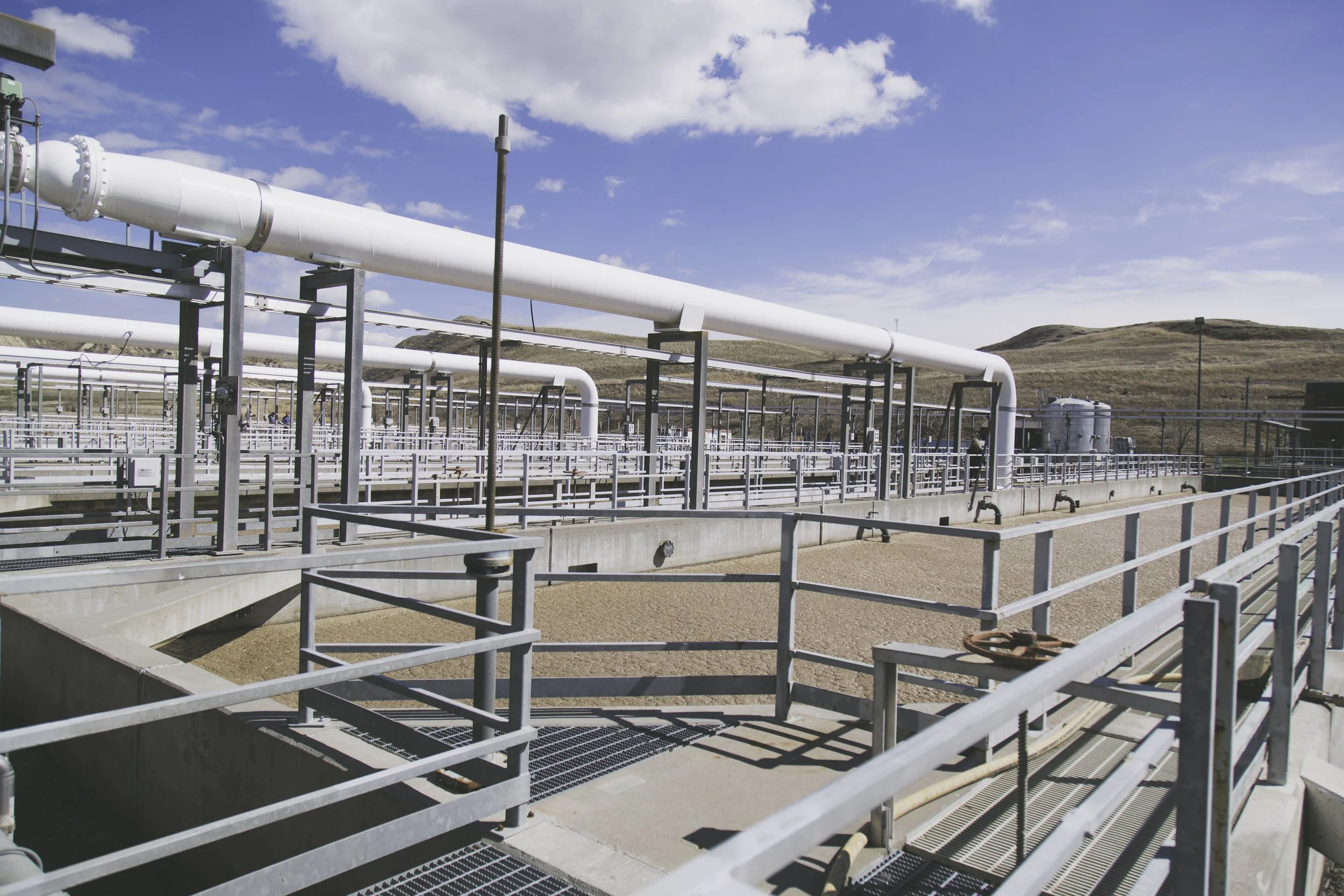 many pipes lining the roof of a water treatment plant
