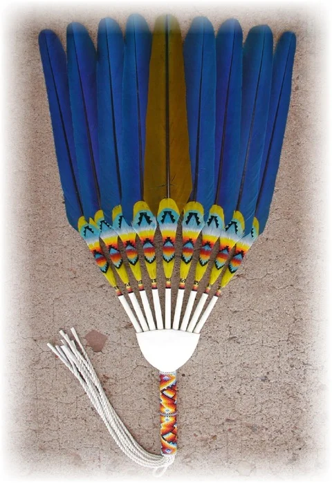 This is a Stiff Flat Fan, INDIVIDUAL. The big difference on this one is that each individual feather is feather worked. The feathers in this fan does one move, they are permanently set, it is a stiff fan. This type of fan would be used by dancers, or by ladies in the peyote ceremonies. Many traditional dancers (common among both men and ladies) and jingle dancers like this style fan. Usually a bigger fan box is needed for this type of fan. Some people prefer straight cut fringes on these types of fans. Most NAC people prefer twisted leather fringes on these types of fans.