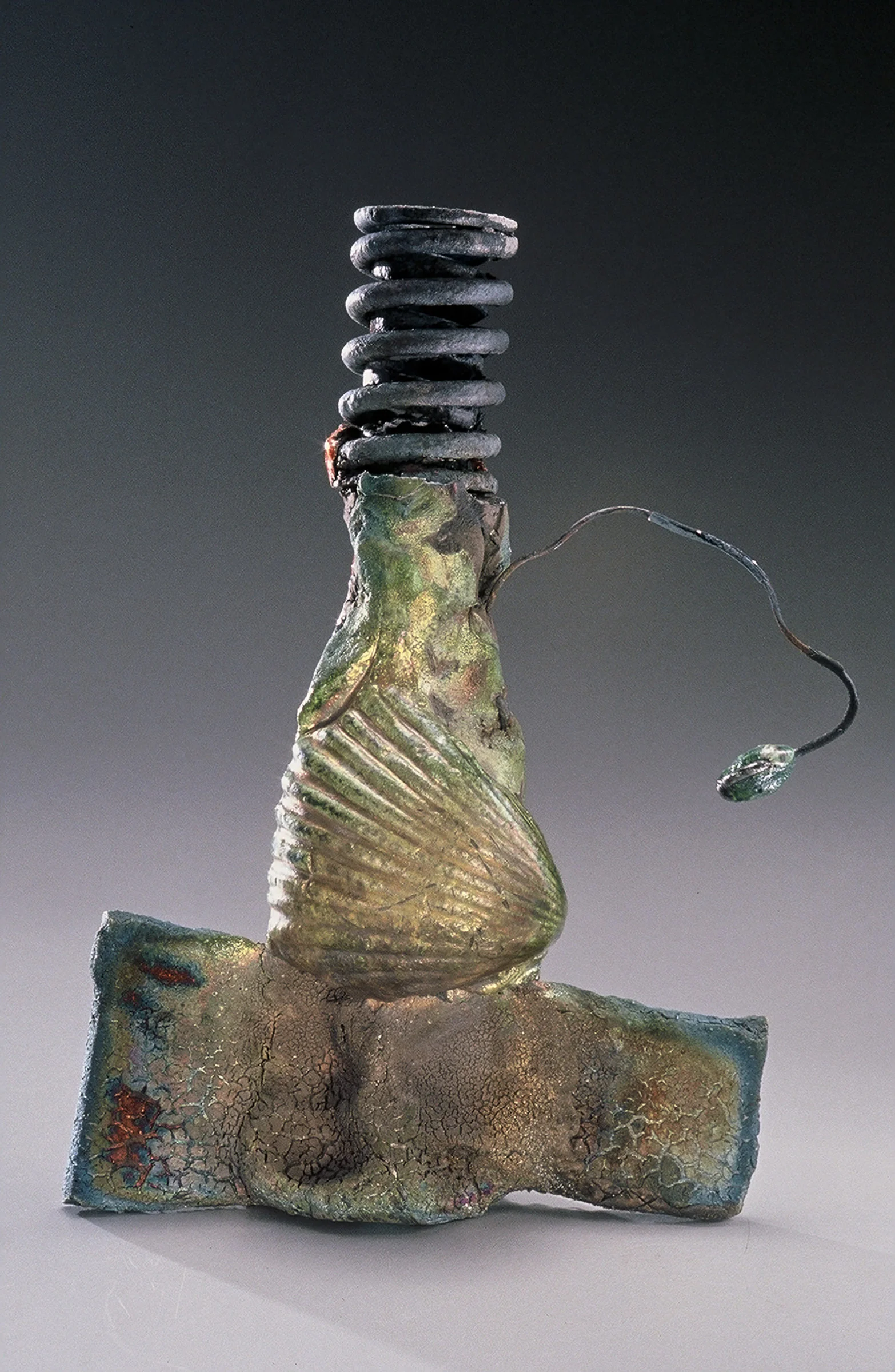 THE FISHERMAN Raku-fired metal and clay 2000. 15” H x 4” diameter. In a private collection