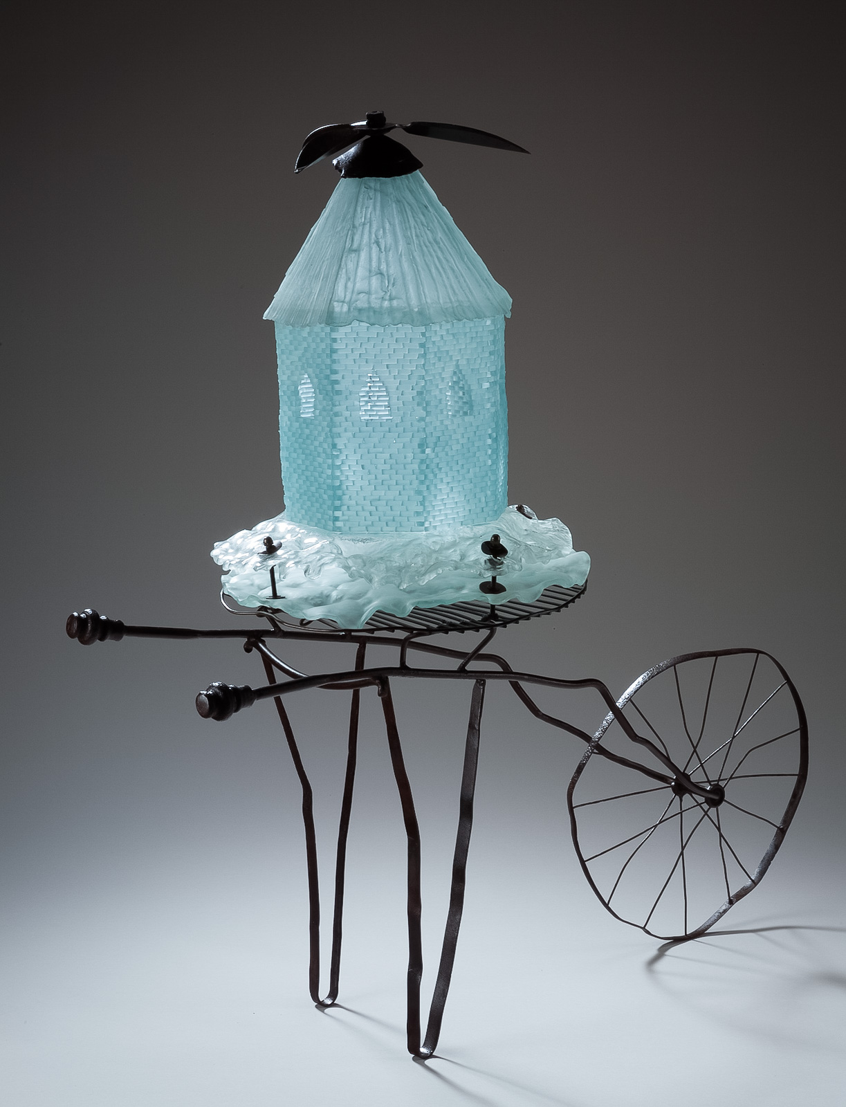 Kenosis : migrations and immigrations Scrap metal and glass, 2008. 49” h x 24” w x 48”l Individual sculptures made of recycled glass and metal related to immigration and migration