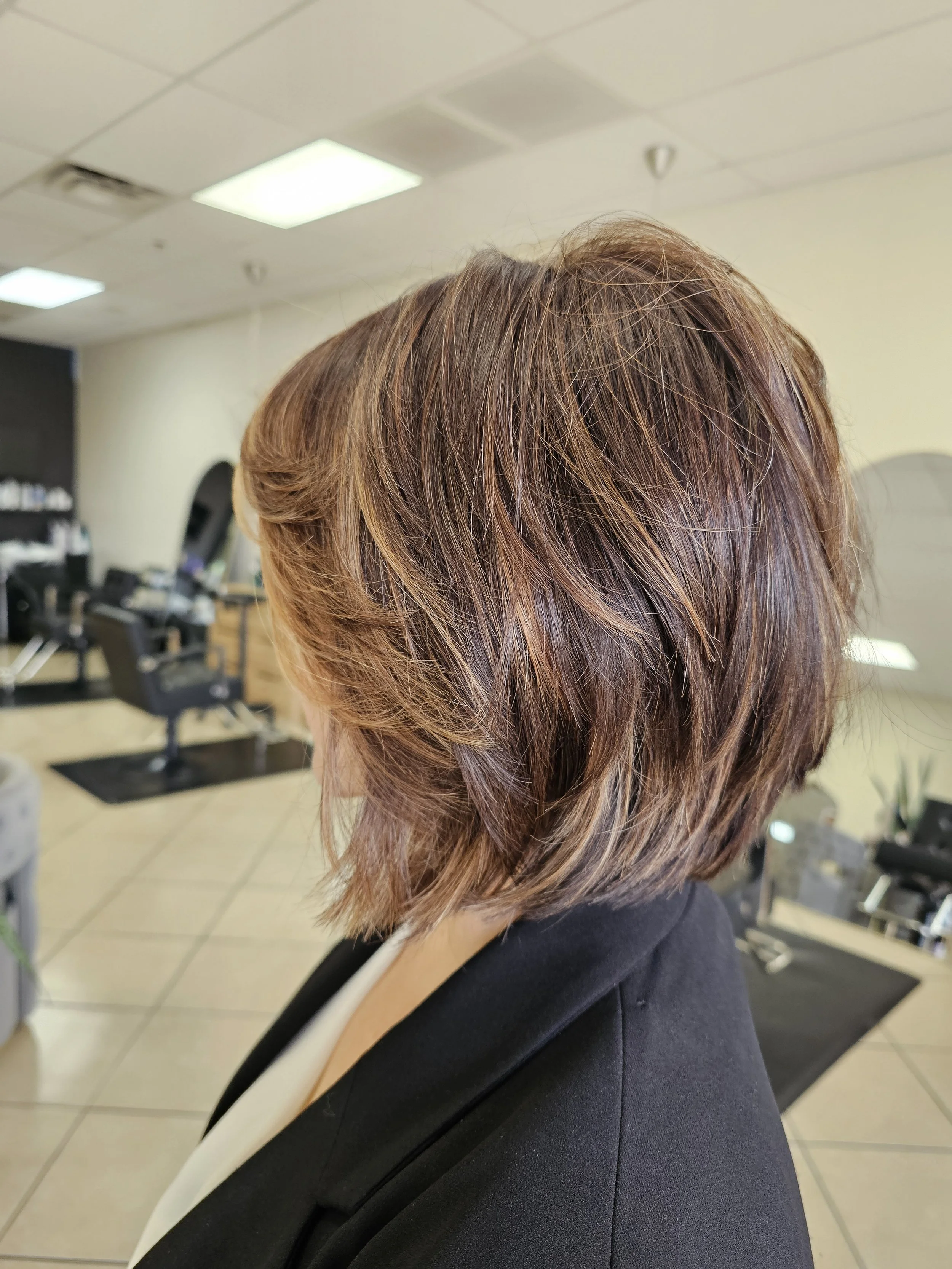 Short Textured Bob Haircut by Stacey
Short Layers with slight angle towards the front. Perfect blend of volume and a "Long Bob" Look