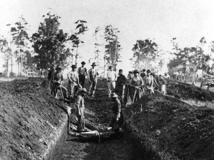 Burial Detail at Andersonville, a Confederate prison for Union soldiers, August 1864. In the 1860s, a 'dead line' was a line within or around a prison. Prisoners would be shot for crossing the 'dead line'.