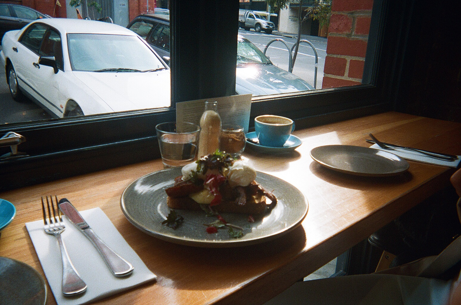 Proud Mary's pine mushroom toast with poached eggs and a div ine parmesan pudding.