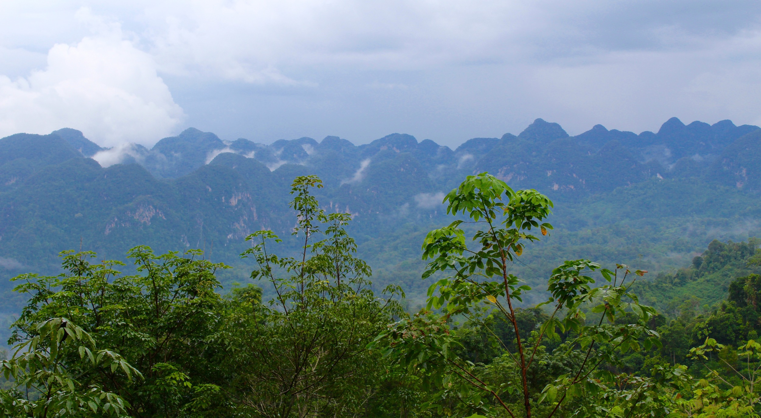  A view across the valley near Silantai, karst formations rising out of the remote valley