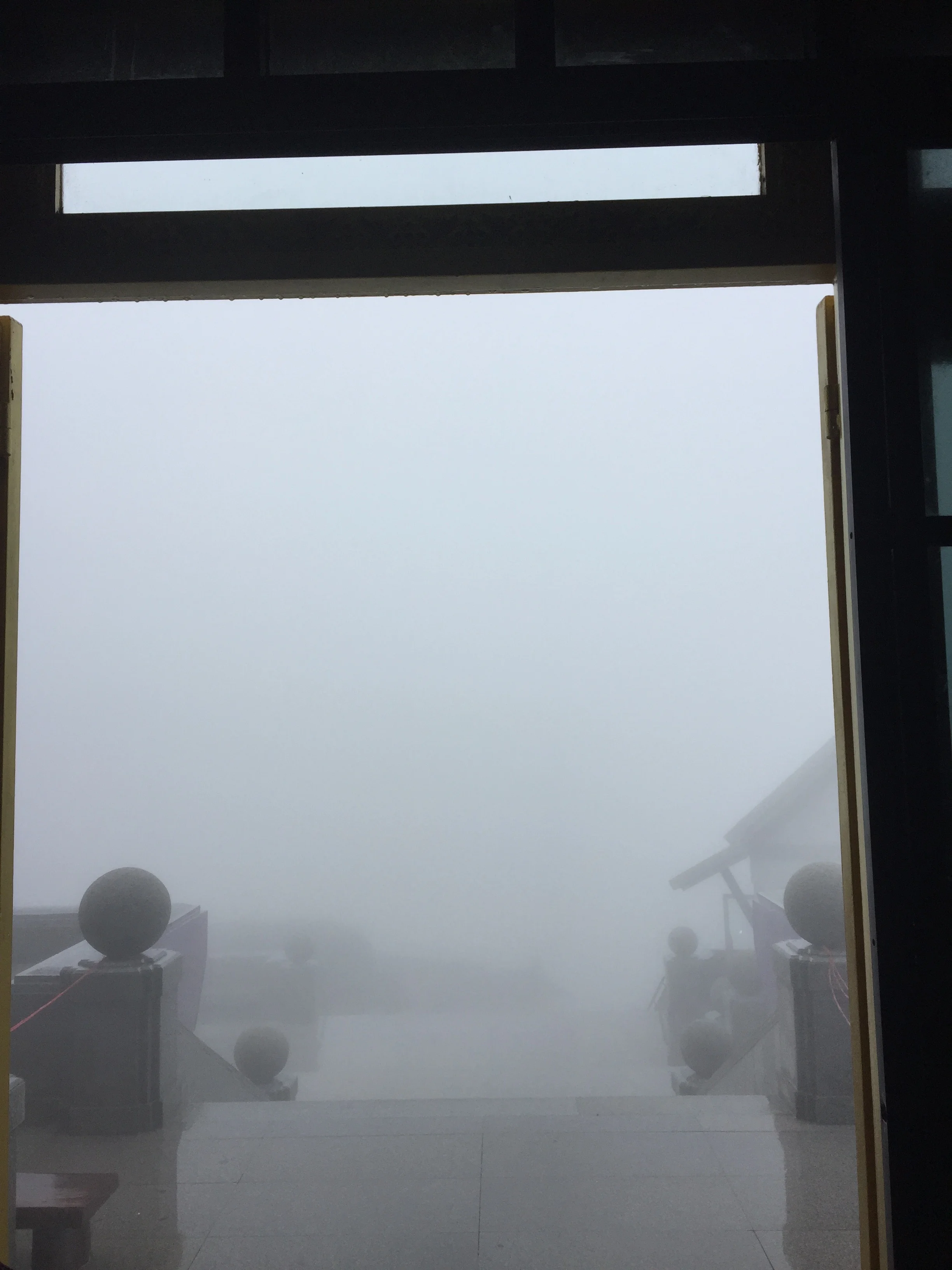Looking out from inside one of the stupas.... you're supposed to see the other stupa and the mountains ...haha!