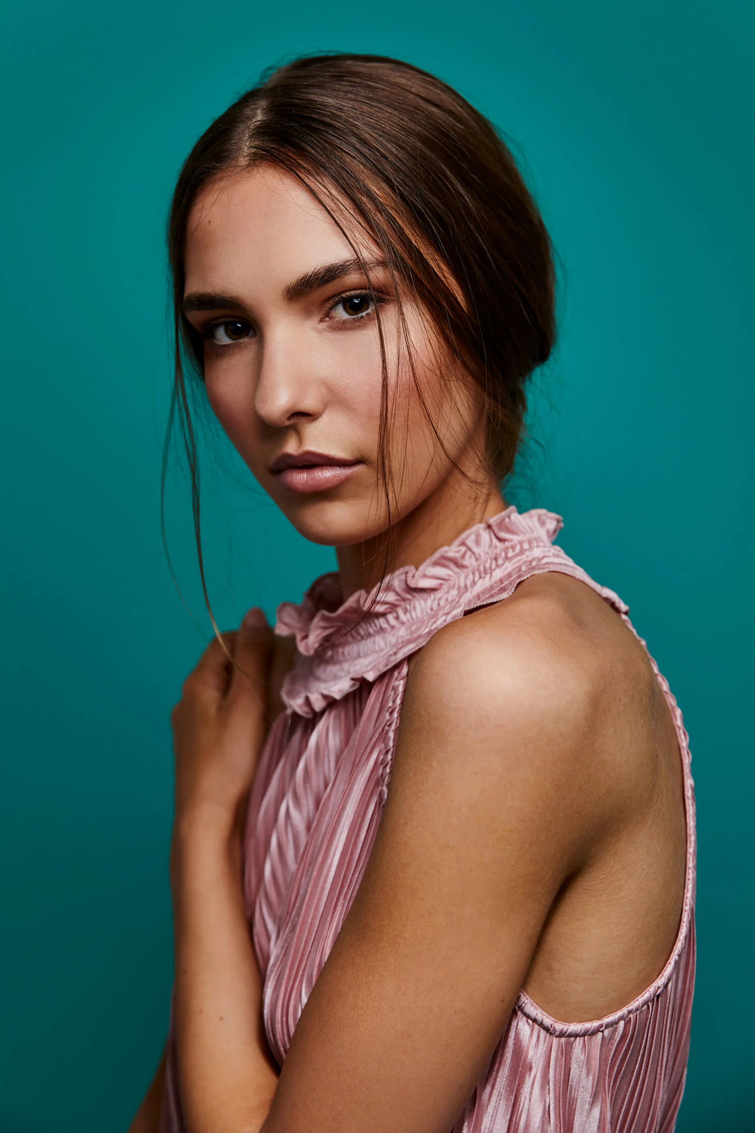 Beautiful Woman in studio with green backdrop