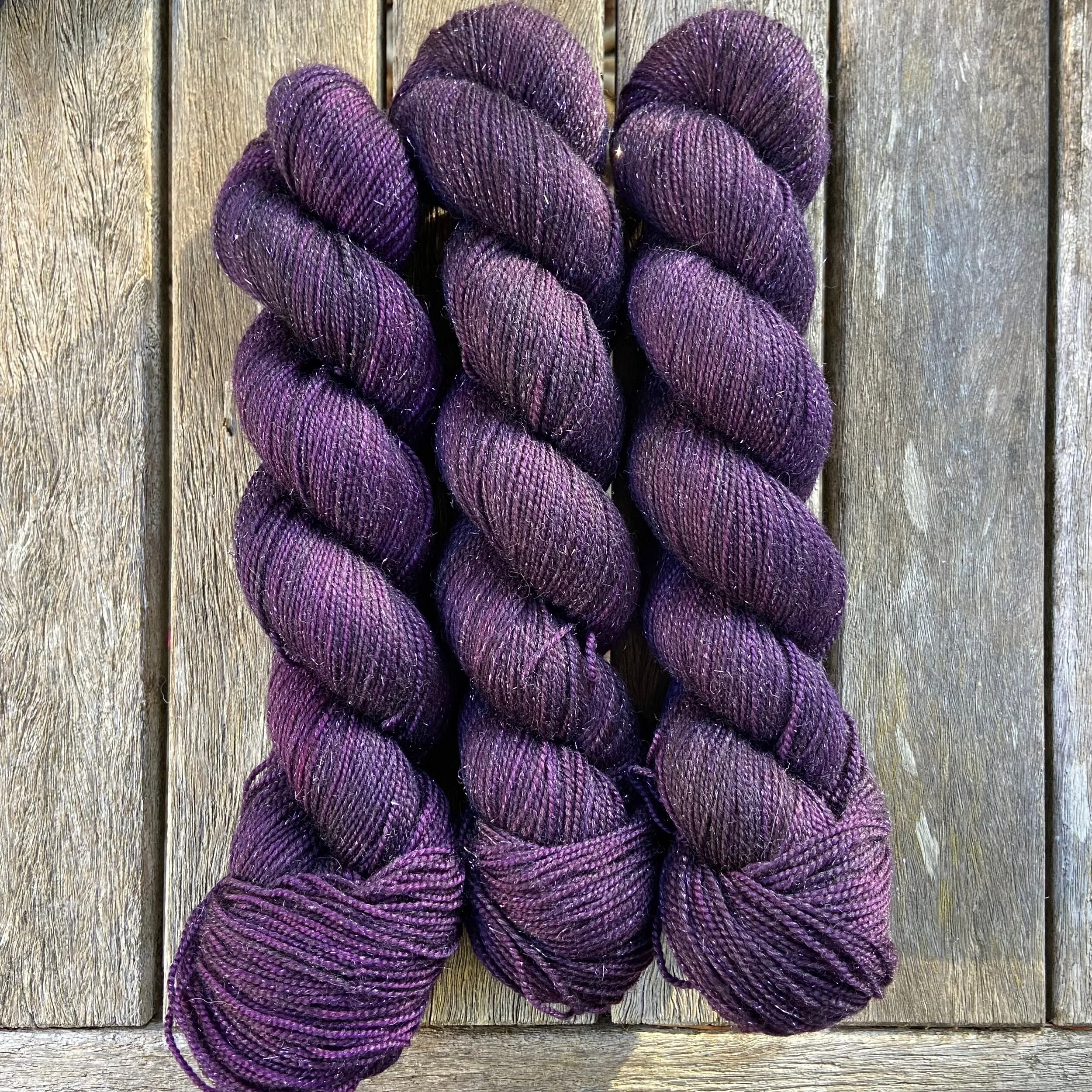 plum stellina hand dyed sock yarn