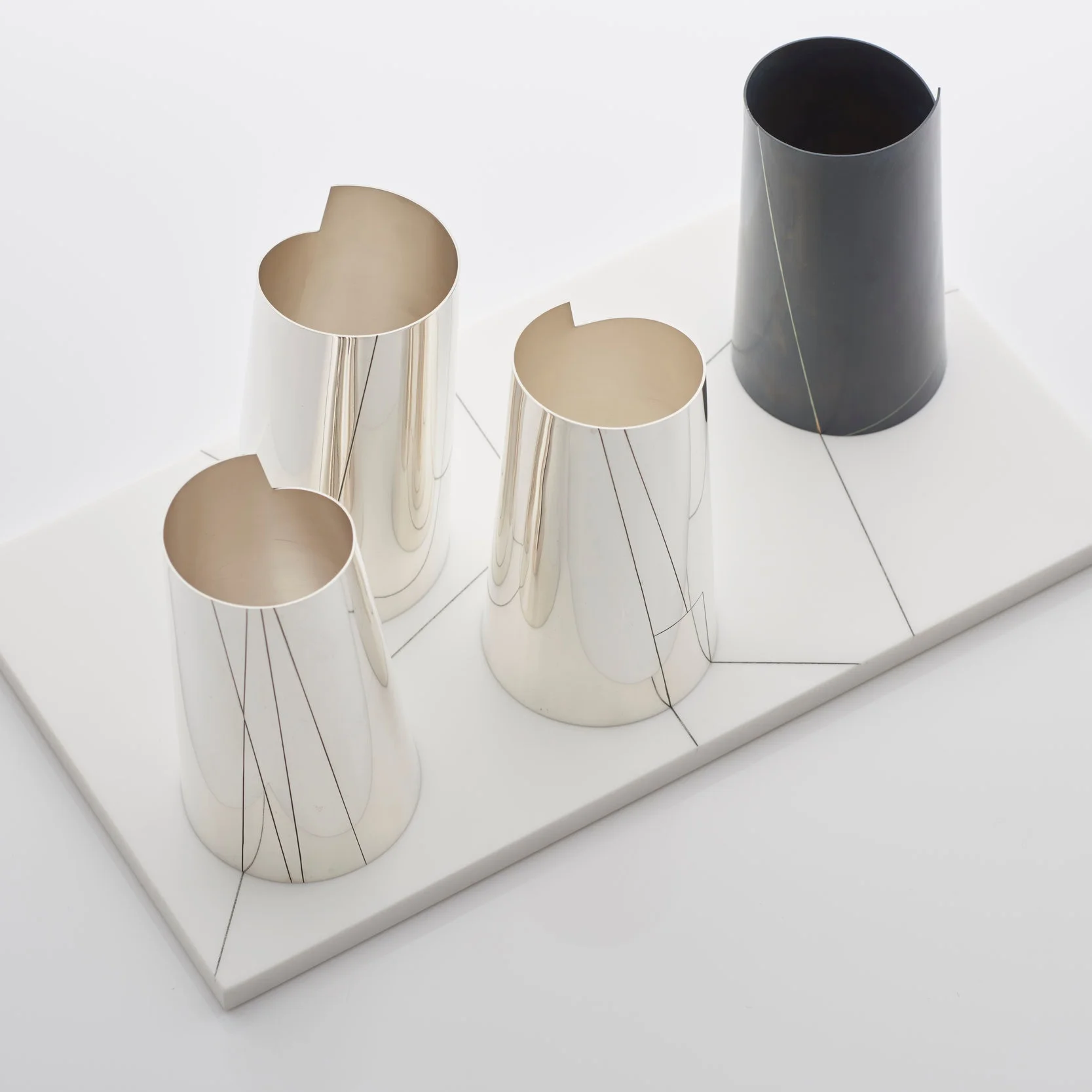 Rebecca+de+Quin%2C+%2522Vector%2522%2C+four+piece+vessel+set%2C+sterling+silver%2C+gilding+metal+and+Corian%2C+2015+%C2%A9Sylvain+Deleu_7+.jpg