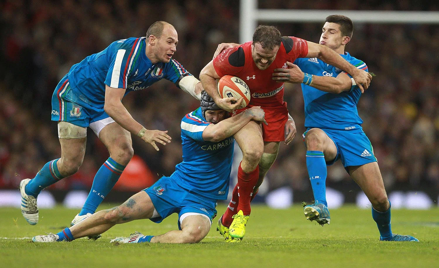 Jamie Roberts of Wales battles past the Italy defence