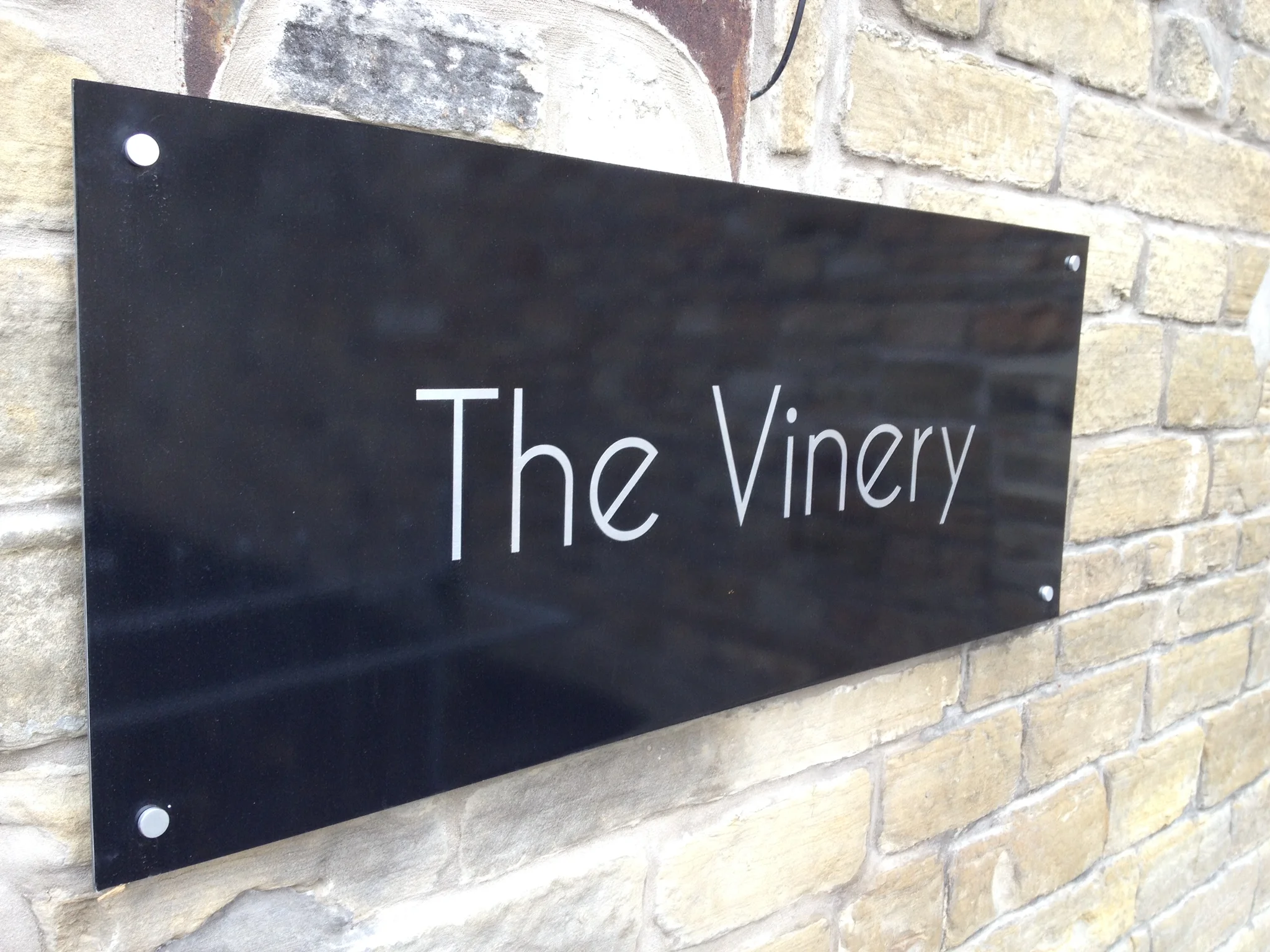 Black acrylic sign