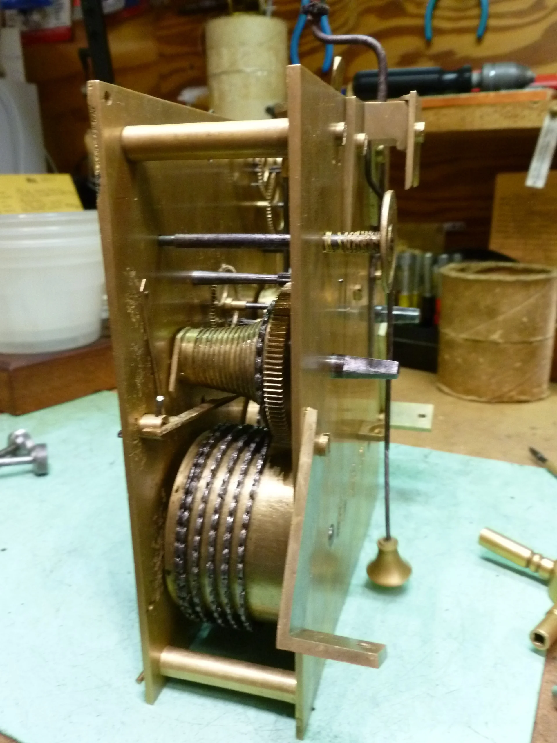 In this picture you can see the pendulum and winding arbors. This clock you wind from the back.