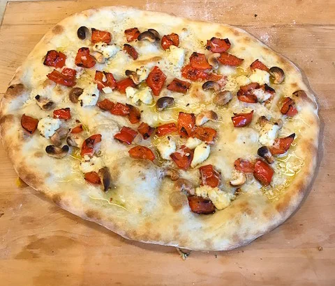 Mixing it up with roasted garlic cloves, red peppers, cashews, and vegan feta