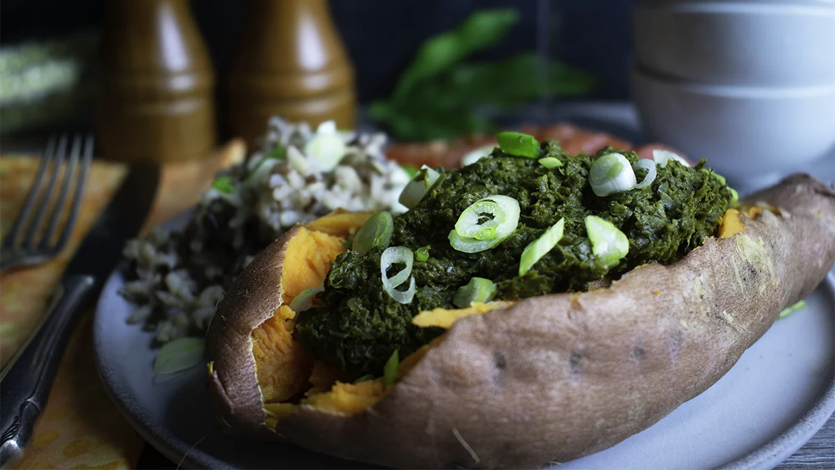 Creamy Collard Greens Puree in a baked sweet potato