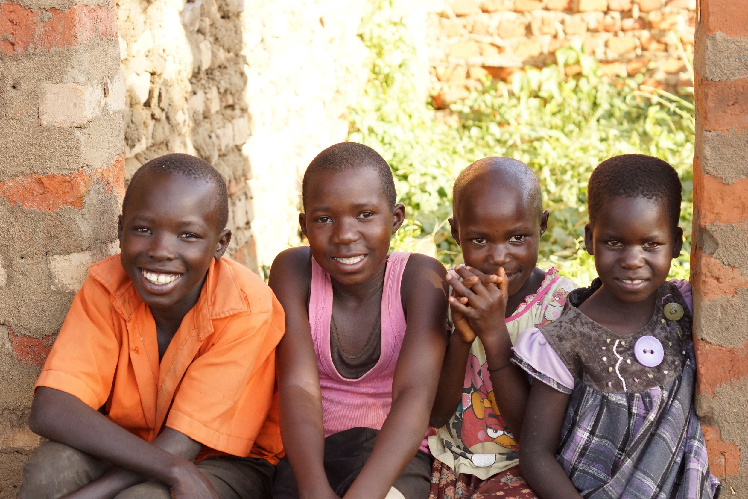 Future students sitting at our classroom site in Namasale