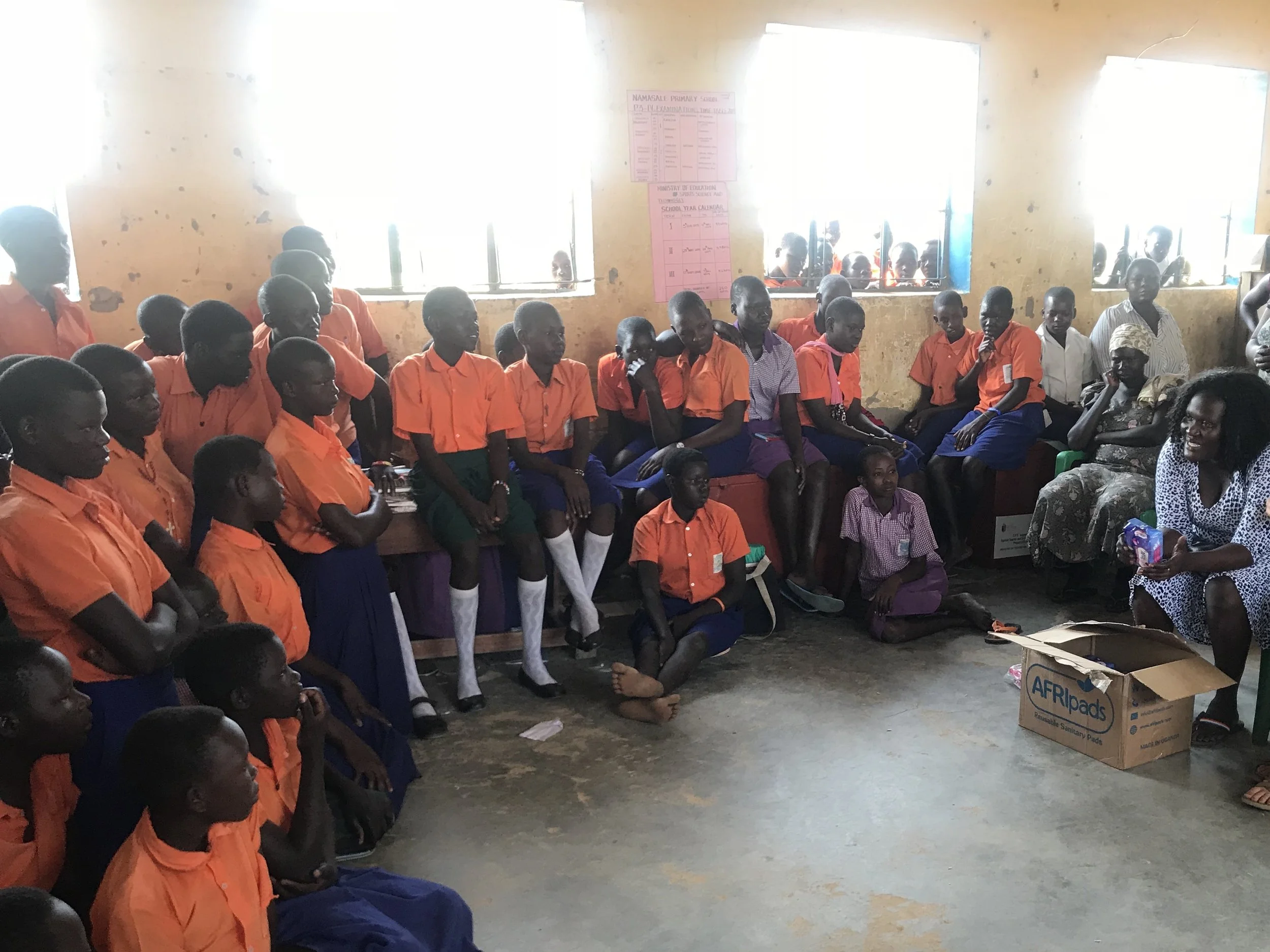 Our Co-Founder & Country Director, Collines, who was born & raised in Namasale, Uganda, sharing her story to the students at one of our partner schools.
