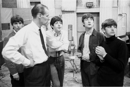 The Beatles recording at Abbey Road with George Martin. 