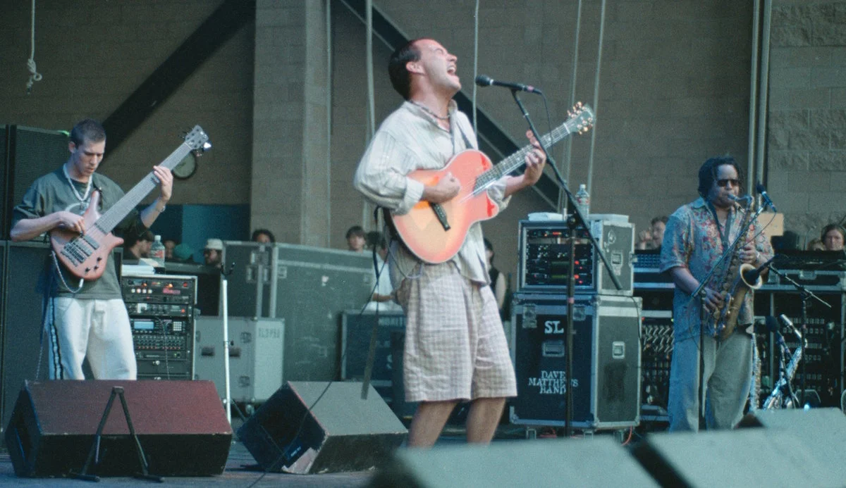 DMB touring for the Crash album. From left: Stefan Lessard, Dave Matthews, LeRoi Moore performing at the Blockbuster Pavillion in Los Angeles on July 27, 1996. (Getty Images)