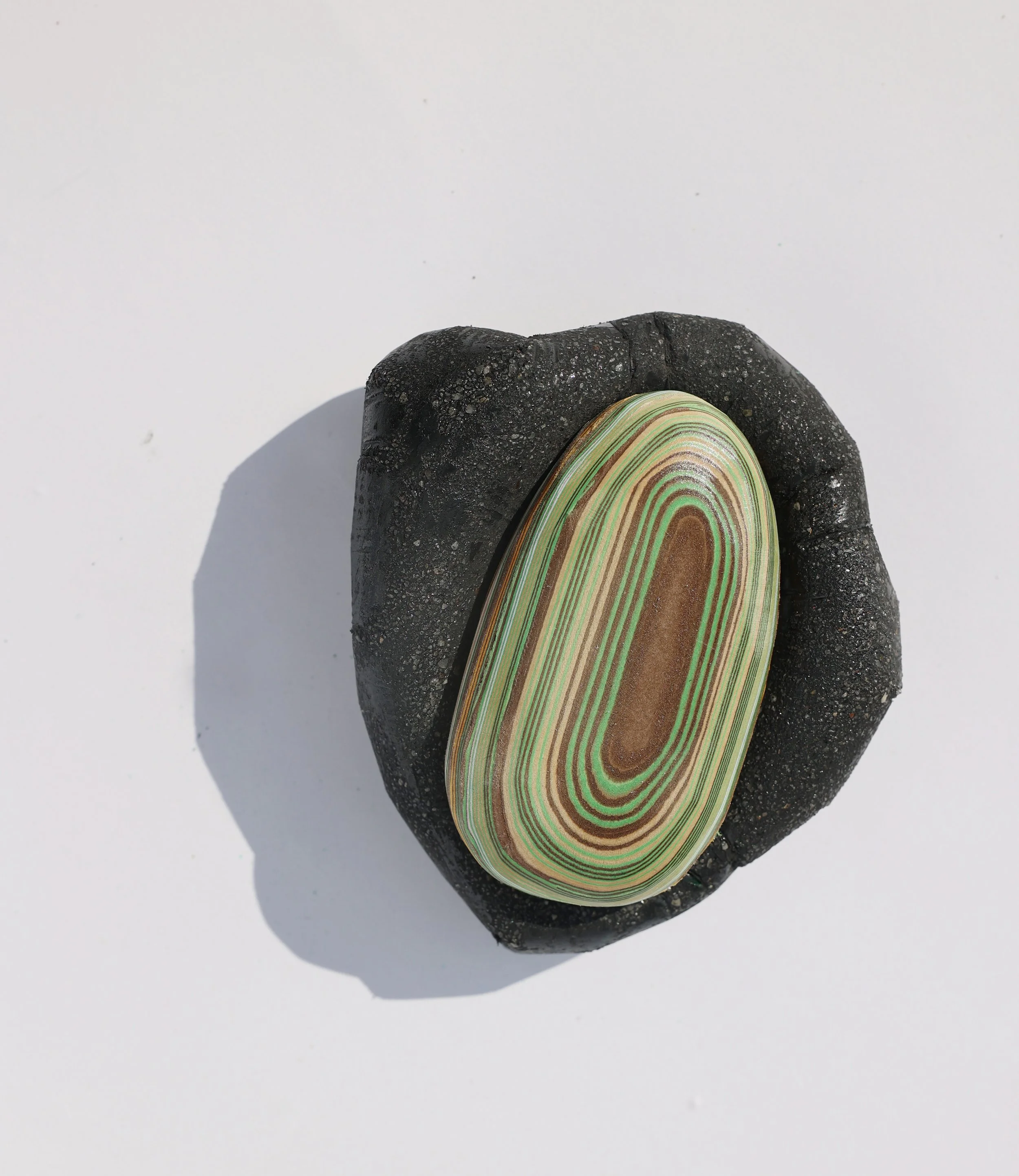 Black with green long pebble.jpg