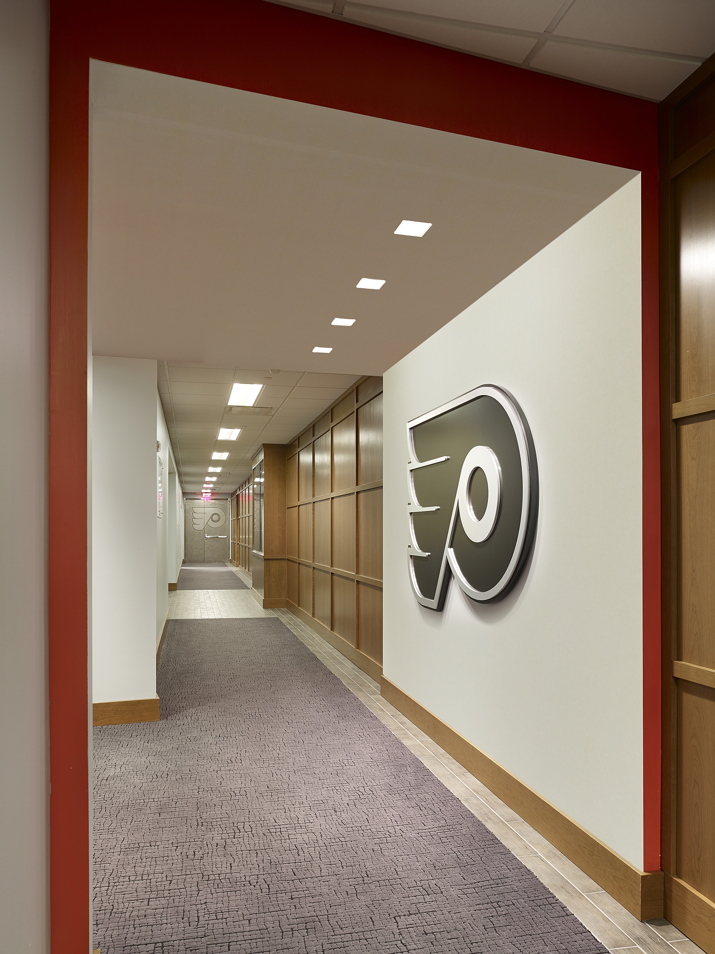 Memorabilia and traditional design elements were incorporated with modern motifs to create the atmosphere of a clubhouse - combined with the proud history of the Flyers franchise - for the present team.