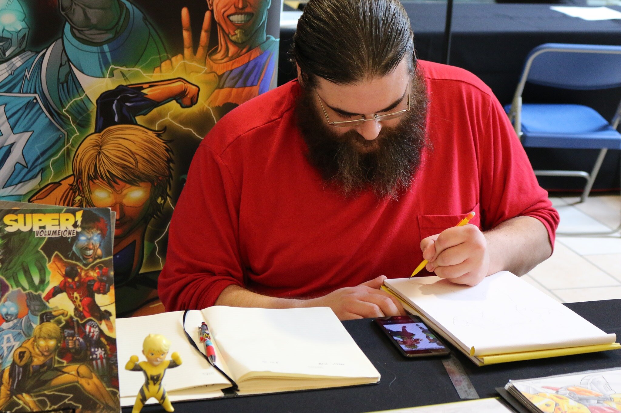 Here’s Zack doing a sketch commission.
