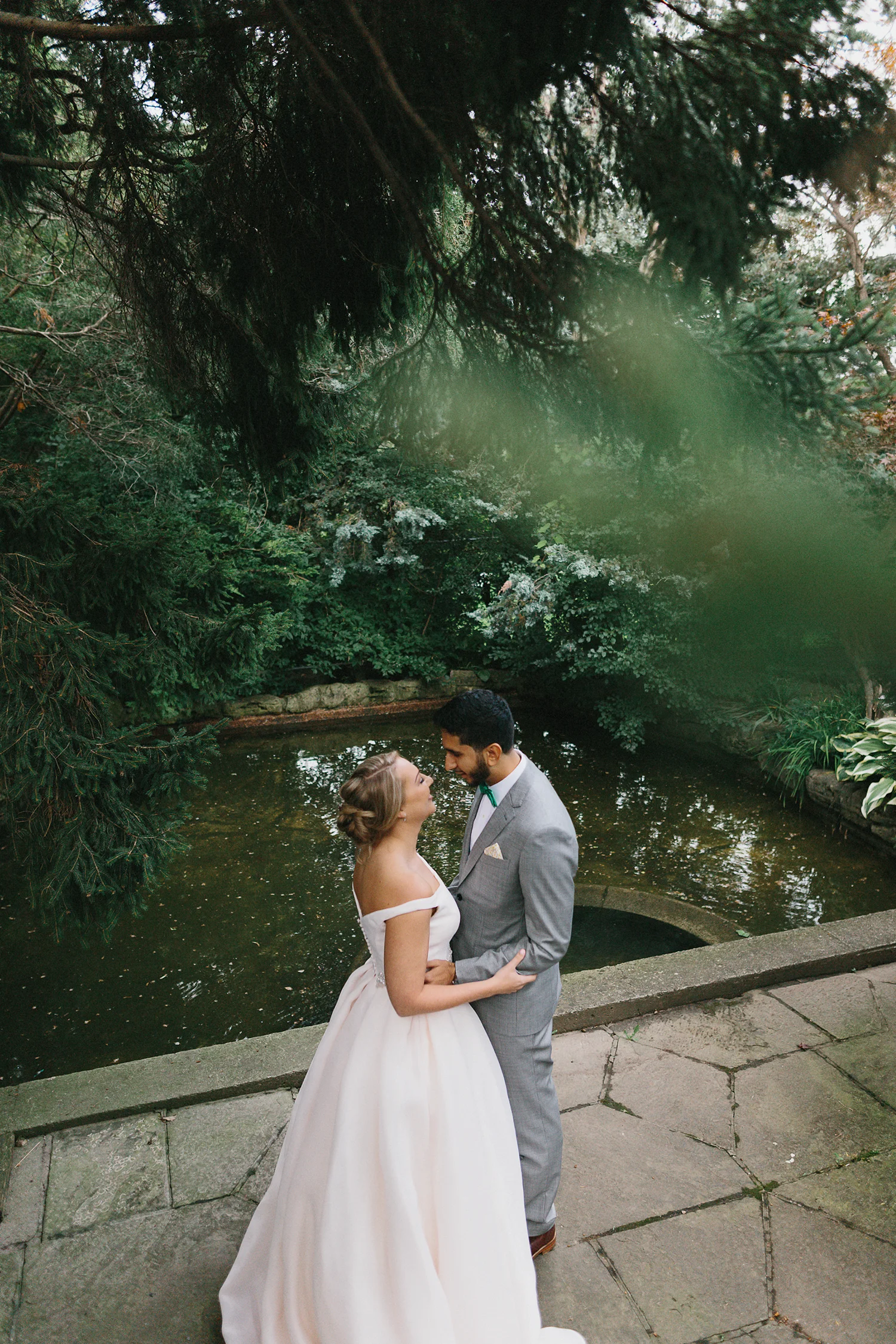 Graydon-Hall-Manor-Wedding-Toronto's-Best-Wedding-Photography-Ryanne-Hollies-Intimate-Small-Modern-Colourful-Wedding-First-Look-on-the-grounds-bride-walking-up-to-groom-dramatic-candid-authentic.jpg