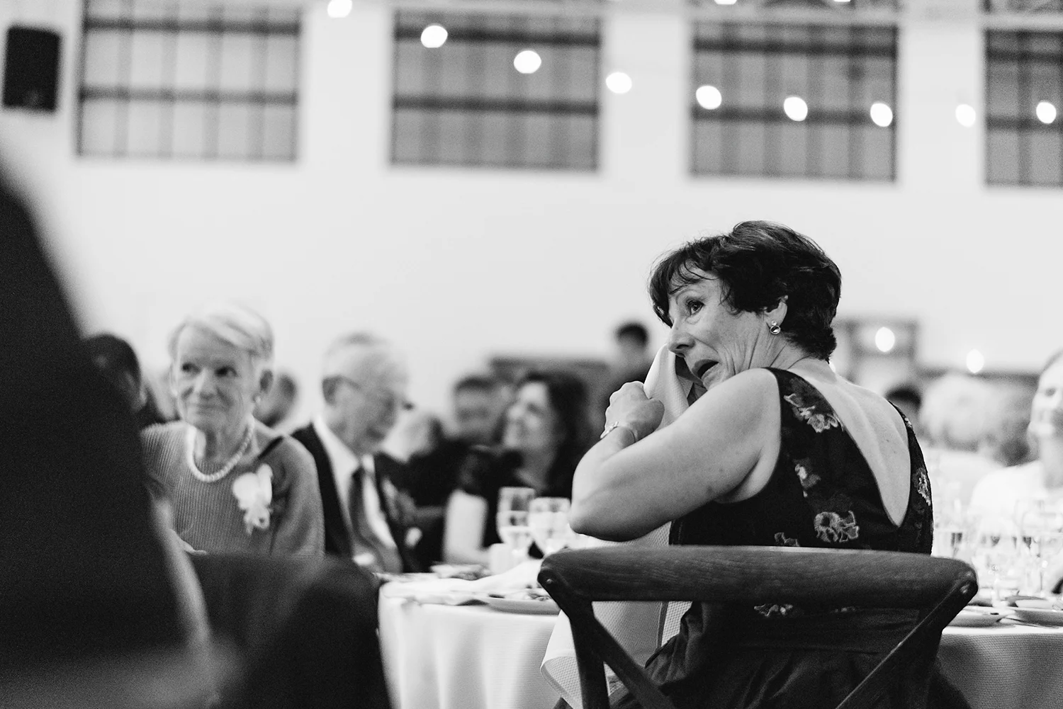 torontos-best-wedding-photographers-ryanne-hollies-photography-photojournalism-artistic-moody-toronto-airship37-graffiti-editorial-reception-bride-and-groom-speech-mom-crying.jpg