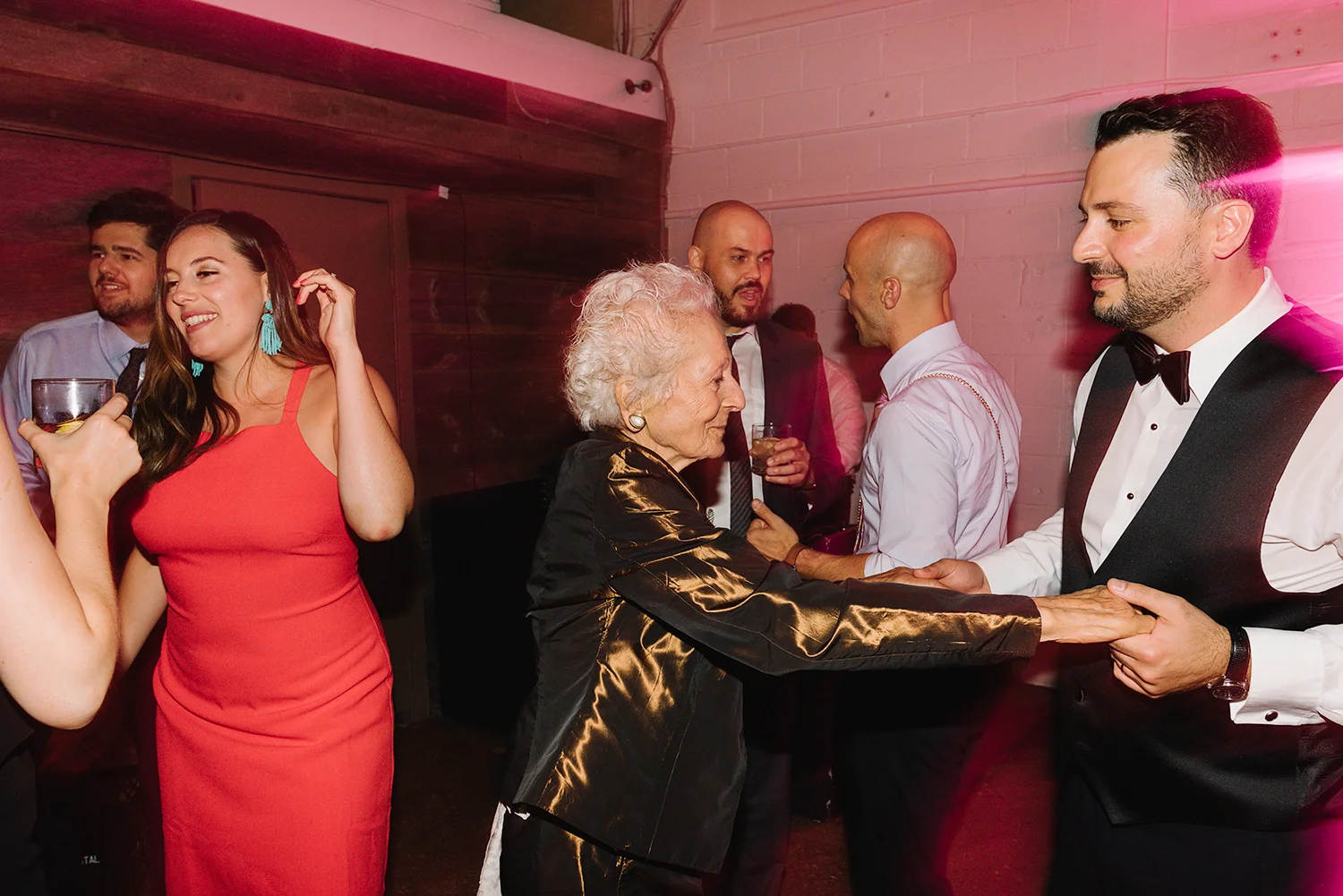 torontos-best-wedding-photographers-ryanne-hollies-photography-photojournalism-artistic-moody-toronto-airship37-graffiti-editorial-reception-dancing-together-hilarious-good-times-memories-dancing-partying-photos-grandmas-hugging-groom-shoes1.jpg