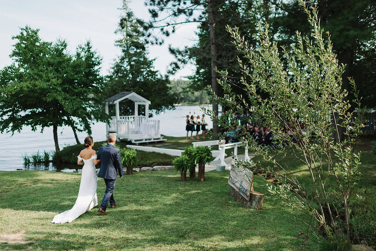 muskoka-wedding-photographer-toronto-wedding-photography-hidden-valley-resort-documentary-photojournalistic-ceremony-space-lakeside-cute-rustic-white-chapel-bride-walking-in-with-dad-epic.jpg