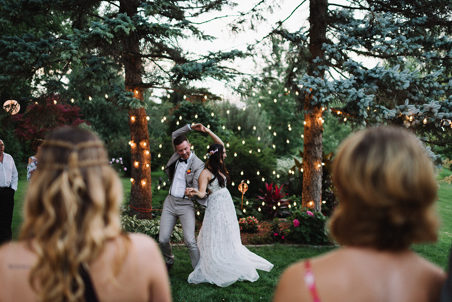 Backyard-toronto-film-photographer-ryanne-hollies-photography-diy-string-lights-and-lanterns-reception-first-dance-documentary-fun-candid-dancing.jpg