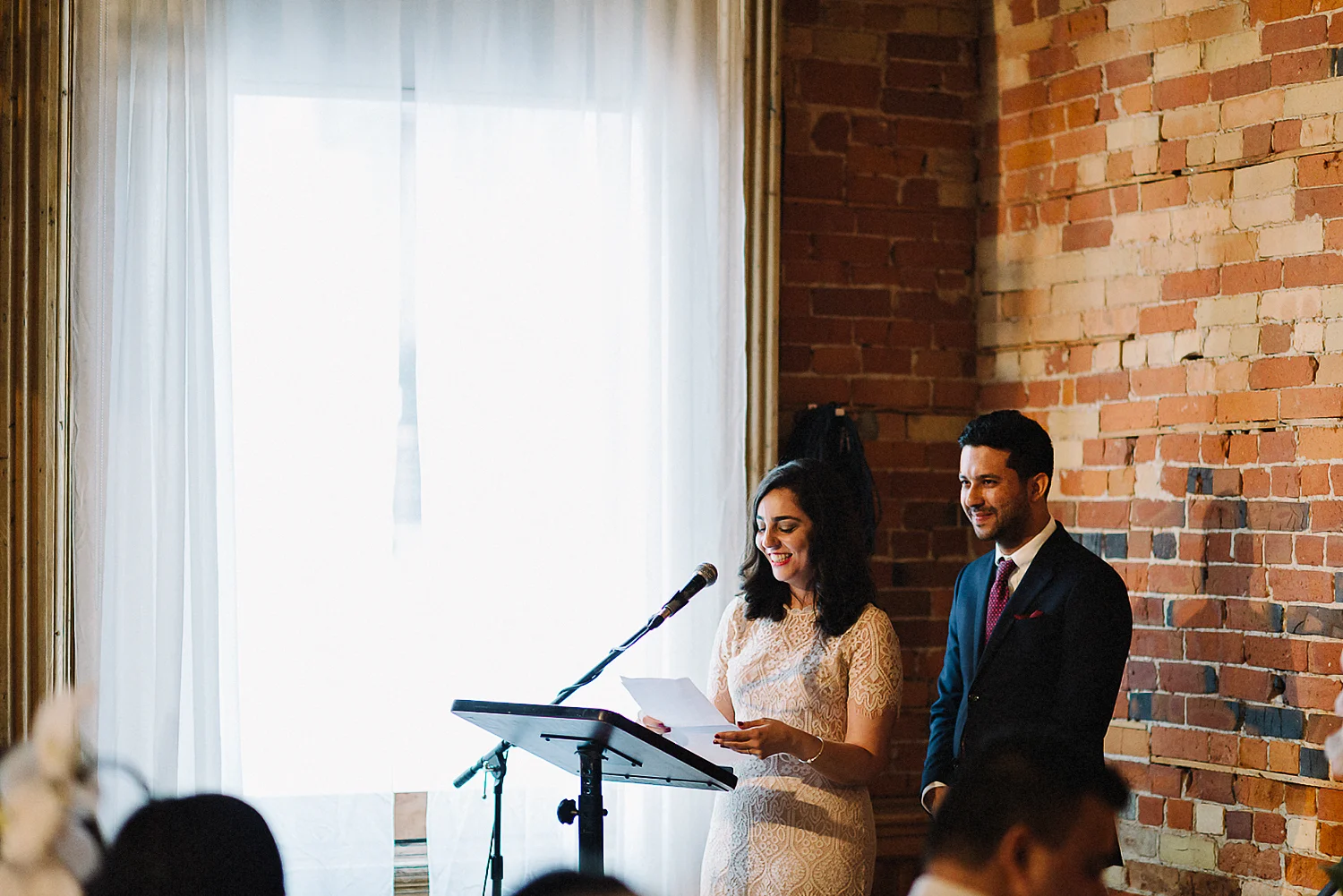 Best-photojournalistic-wedding-photographers-in-toronto-documentary-style-wedding-photography-ryanne-hollies-intimate-portraits-of-bride-and-groom-inside-gladstone-speeches-reactions.jpg