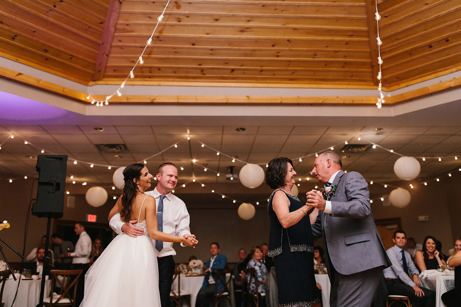 candid-mother-son-dance--father-daughter-together-reception-At-Eganridge-Resort-Venue-Muskoka-Ontario-Wedding-Photography-by-Ryanne-Hollies-Photography-Toronto-Documentary-Wedding-Photographer.jpg