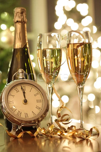 460723_stock-photo-champagne-glasses-ready-to-bring-in-the-new-year.jpg
