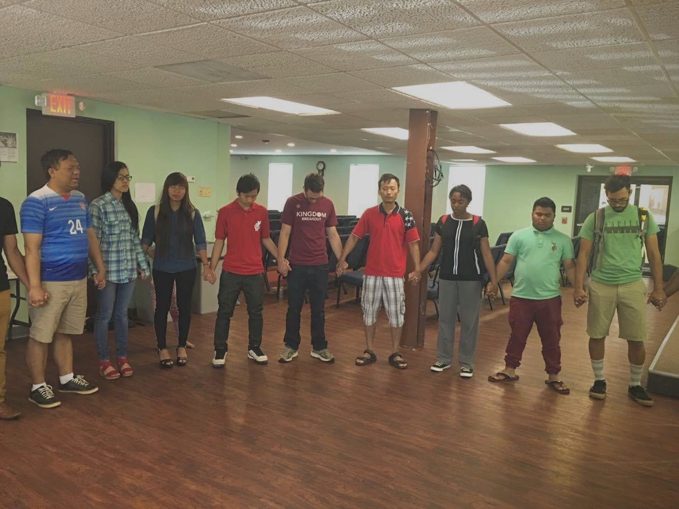 QuadW Columbus interns circle for prayer w/ others in the community 