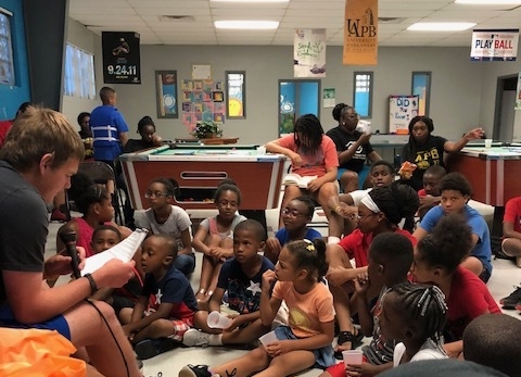 QuadW-Pine-Bluff-intern-reading-teaching-children