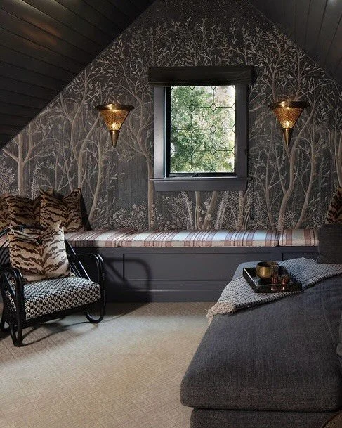 Another day, another transformation! 
This loft started as a blank, underused space with great bones, but no real reason to hang out. We leaned into a moodier direction by wrapping the walls in a patterned wallpaper, painting the ceiling and trim to 