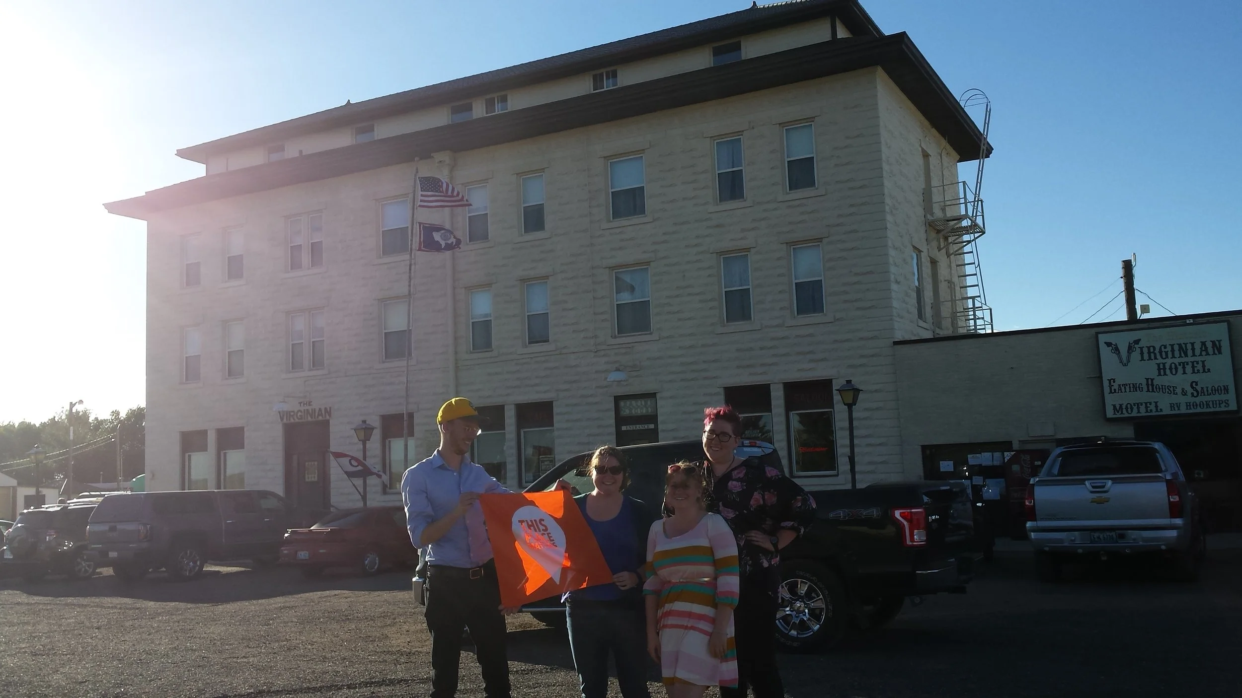 AHW staff celebrates the Virginian Hotel with a "This Place Matters" banner.