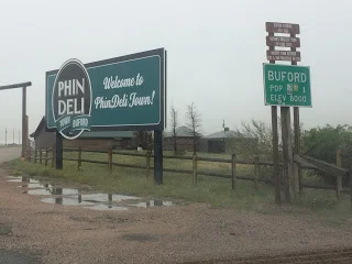 Buford's famous pop. 1 sign. &nbsp;Don Sammons had Buford recognized as a town and requested signs to help bring in customers to his gas station and store. &nbsp;Then he sold the 'town' to Vietnamese investor Pham Dinh Nguyen who renamed it Phin Del…