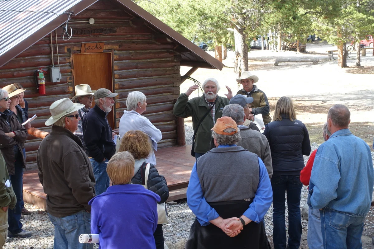 Harrison Goodall conducting a workshop on maintaining and rehabilitating log buildings at Spear-O-Wigwam in Johnson County