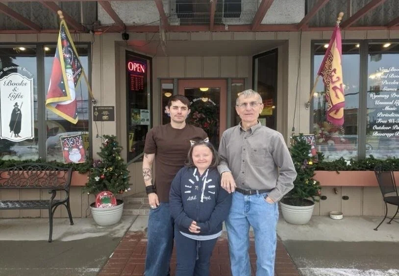 From l to r: Zach, daughter Jade and Dan Brecht in front of their store.