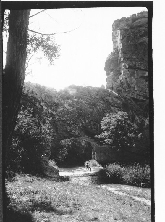 Two people near Ayres Natural Bridge 1938. Photo courtesy of the American Heritage Center.