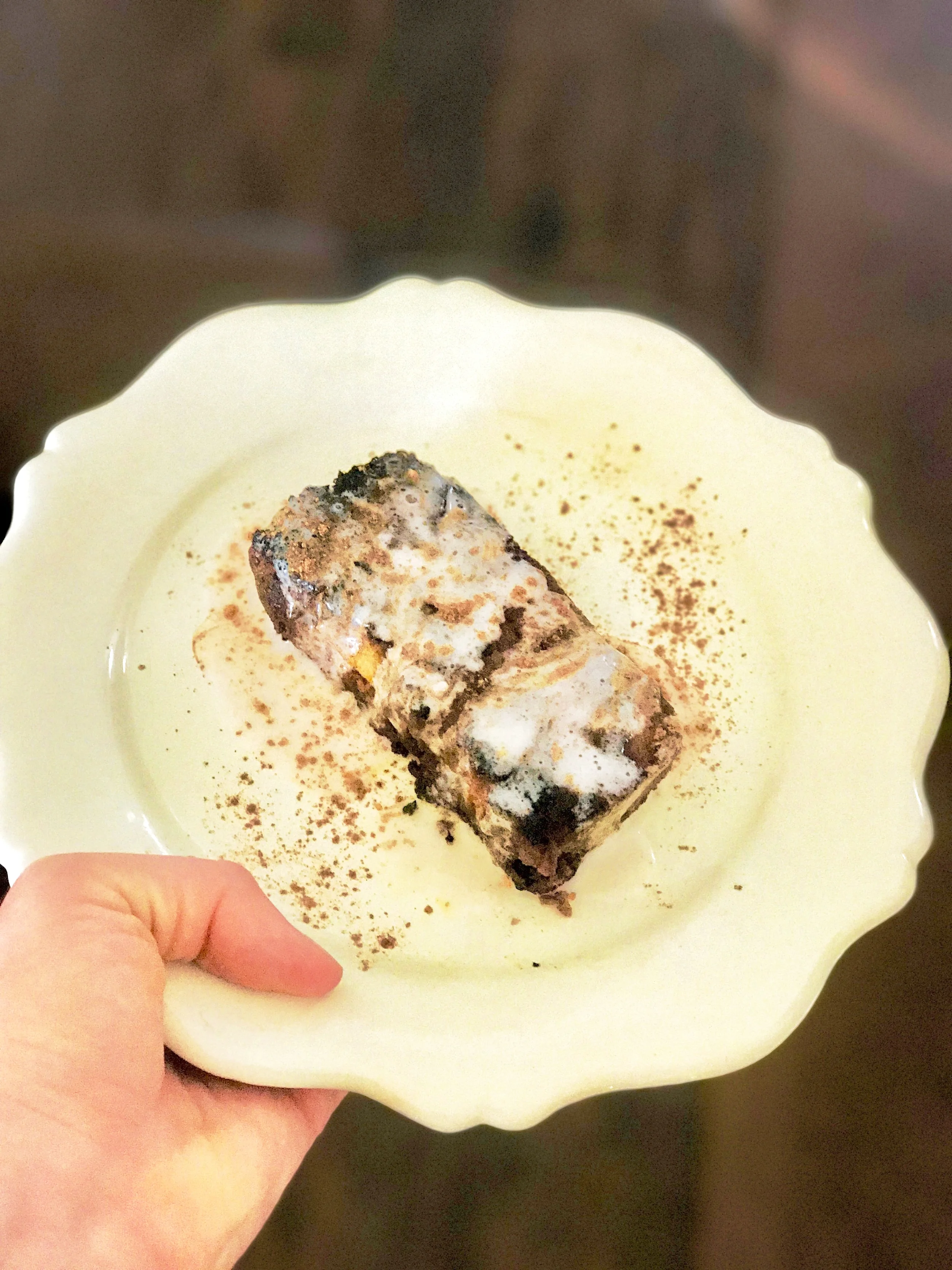 Slice of the Bread Pudding, pan seared in vegan butter and drizzled with vanilla crème anglaise.