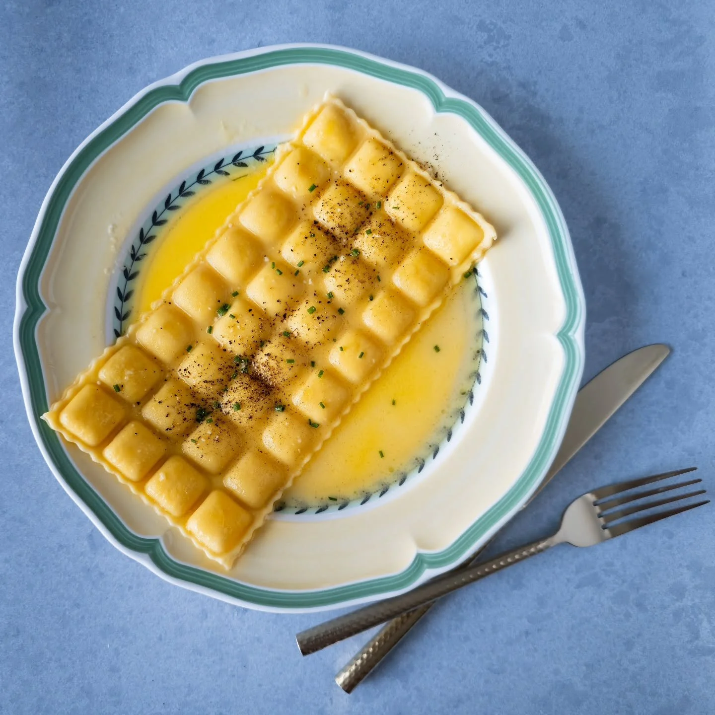 Ravioles du Dauphiné - these French ravioli are delicate, elegant, and packed with flavor! This filling was mainly comte cheese, and I served it in a light white wine butter sauce, with a generous amount of black pepper and fresh chives. You c