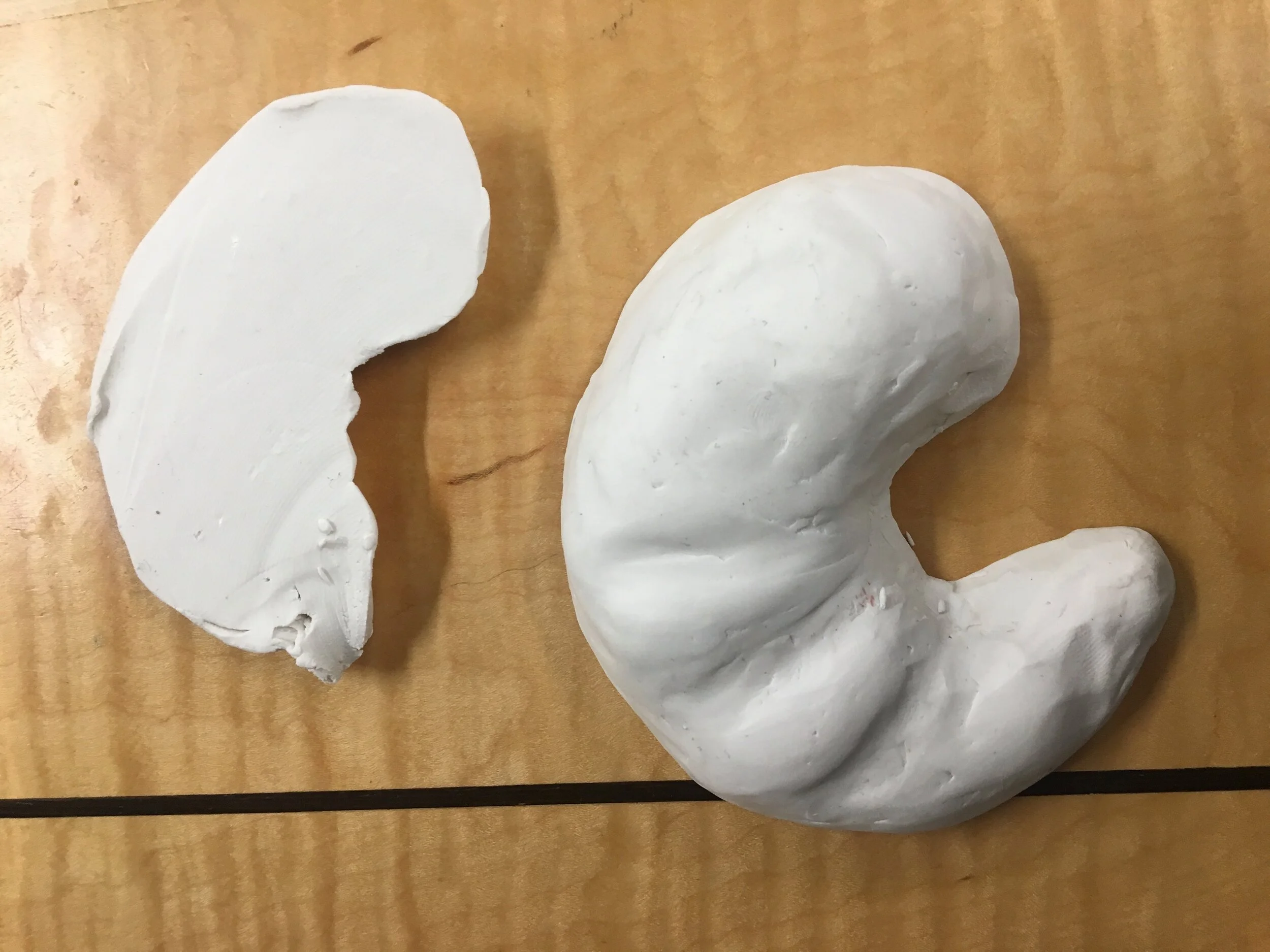 Making a shrimp (aka croissant) that was originally “in the round”, into a 1-sided crustacean. This is a good method for dieting too, I’d assume.